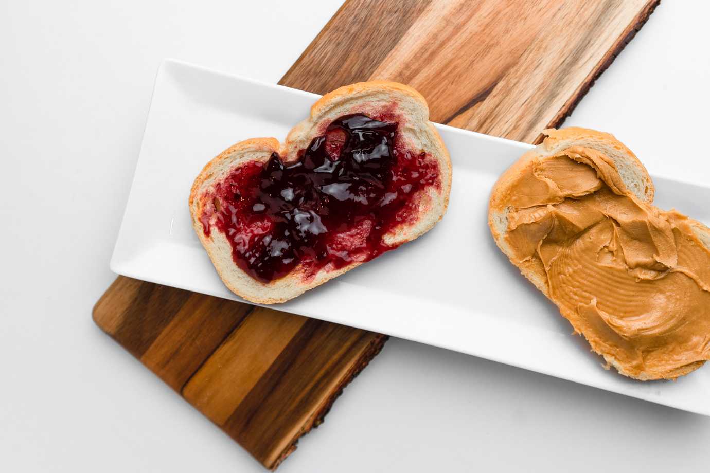 The two halves of a peanut butter and jelly sandwich